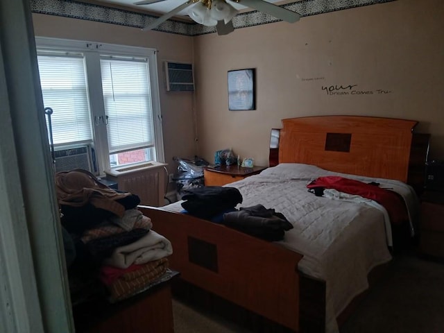 bedroom with an AC wall unit and cooling unit