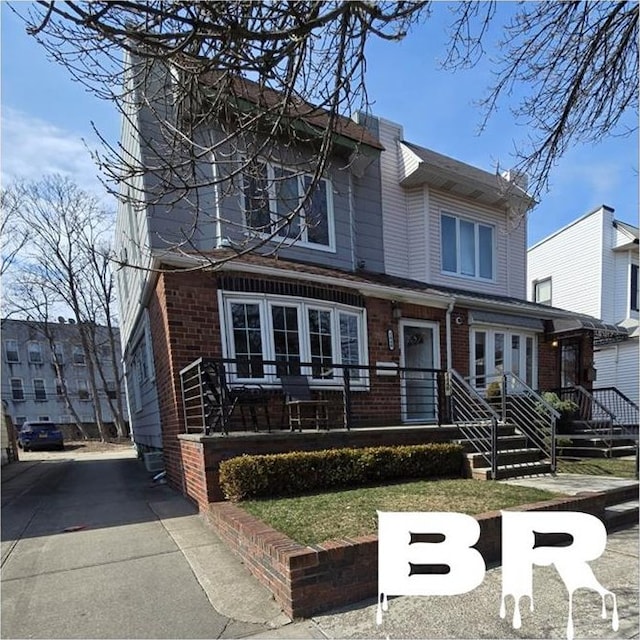 view of front of property featuring brick siding