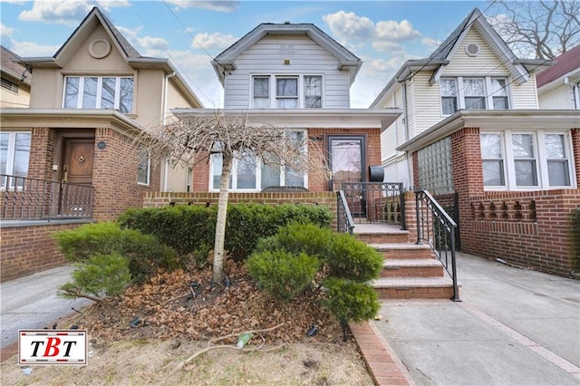 view of front of house featuring brick siding