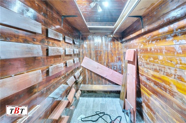 corridor with wood walls and wood ceiling