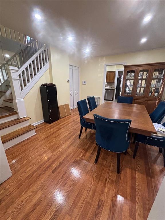 3883 Bedford Ave, Brooklyn, NY 11229 - dining space with wood finished floors, stairs, and recessed lighting