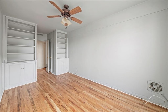 unfurnished bedroom with light wood finished floors, visible vents, and ceiling fan