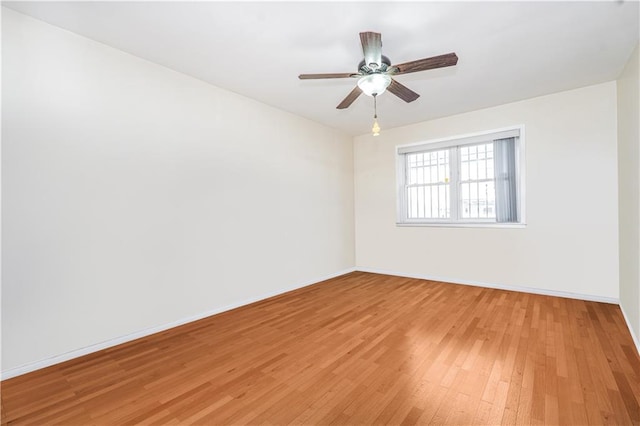 2121 Kimball St, Brooklyn, NY 11234 - unfurnished room with light wood finished floors, baseboards, and ceiling fan