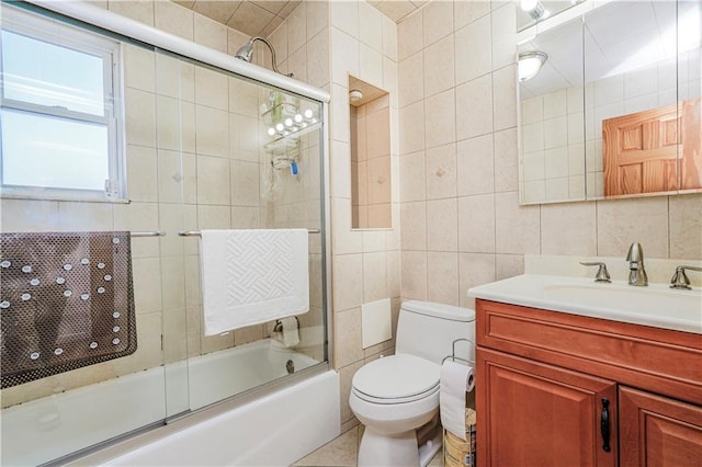 2121 Kimball St, Brooklyn, NY 11234 - full bathroom with tile walls, bath / shower combo with glass door, toilet, and vanity