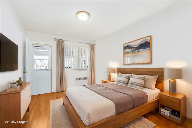 2121 Kimball St, Brooklyn, NY 11234 - bedroom with radiator heating unit and light wood-type flooring