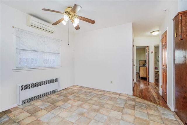 2121 Kimball St, Brooklyn, NY 11234 - spare room featuring radiator, a wall unit AC, stone finish floors, a ceiling fan, and baseboards