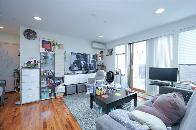 8895 26th Ave Unit 4A, Brooklyn, NY 11214 - living room with wood finished floors, an AC wall unit, and recessed lighting
