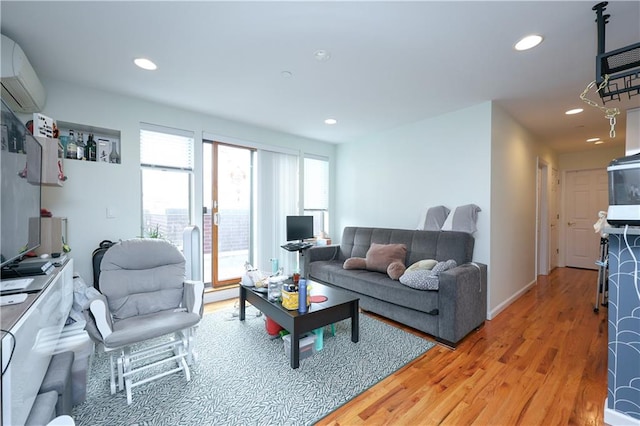 8895 26th Ave Unit 4A, Brooklyn, NY 11214 - living area featuring light wood-style flooring, recessed lighting, and an AC wall unit