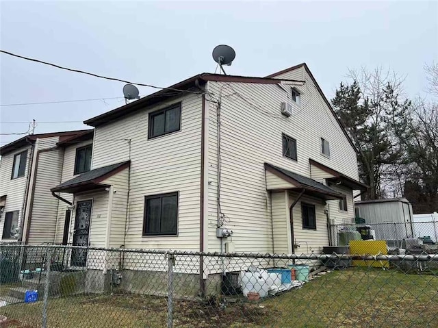 view of home's exterior featuring fence and a yard