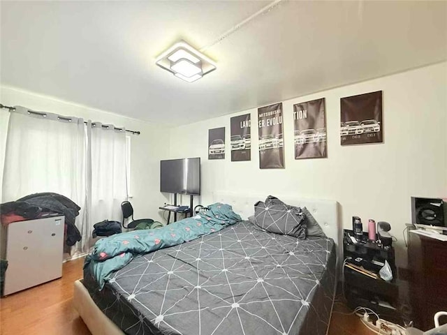 bedroom featuring wood finished floors
