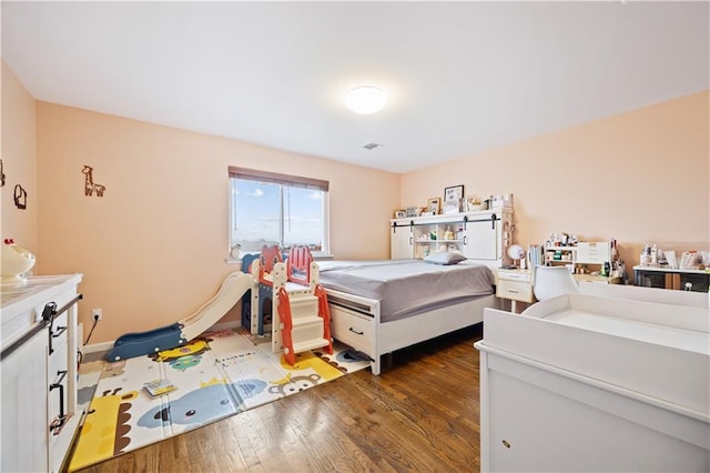 bedroom featuring wood finished floors