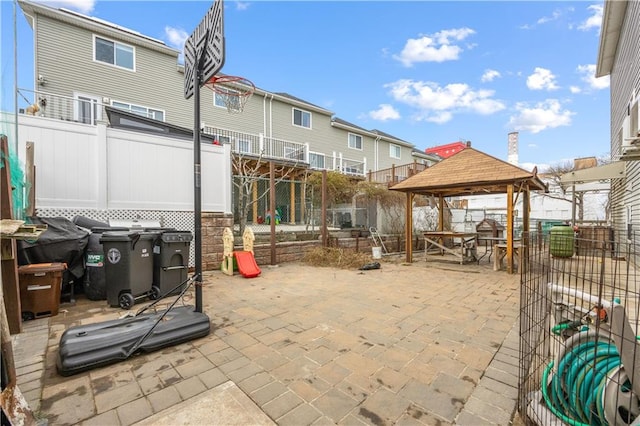 view of patio / terrace featuring a gazebo and fence