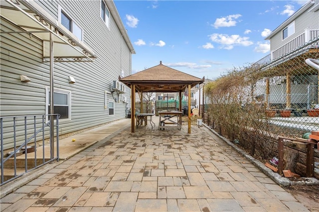 view of patio with a gazebo and fence