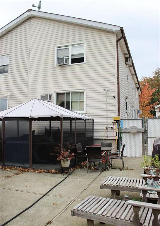 back of house with a patio