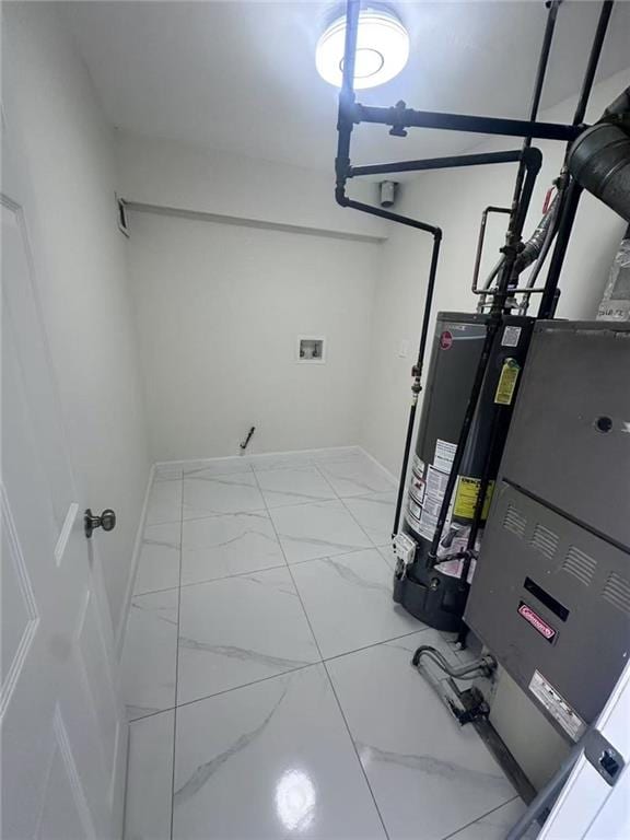 19 Drumgoole Rd, Staten Island, NY 10312 - utility room featuring water heater