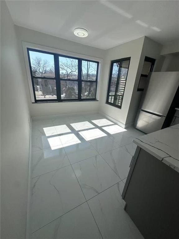 19 Drumgoole Rd, Staten Island, NY 10312 - empty room with marble finish floors and baseboards
