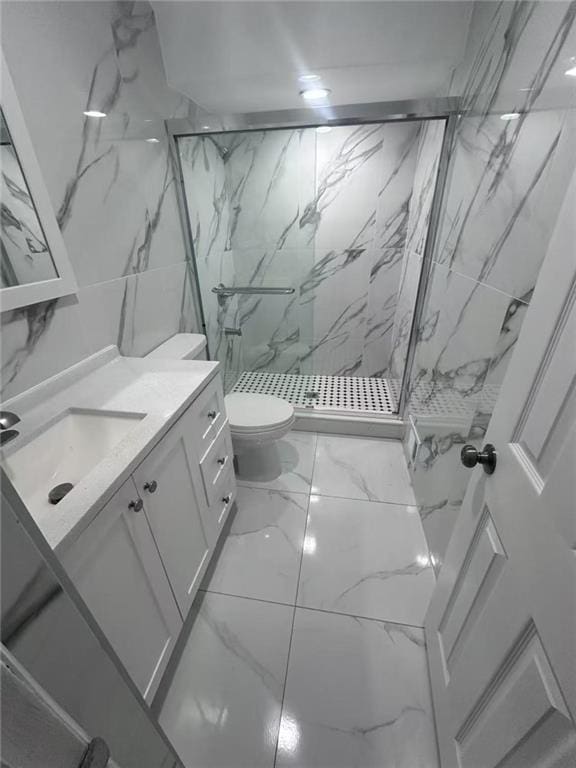 19 Drumgoole Rd, Staten Island, NY 10312 - bathroom featuring a marble finish shower, toilet, marble look tiles, and vanity