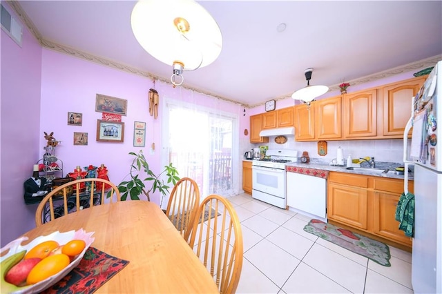 78 Townsend Ave, Staten Island, NY 10304 - kitchen with white gas range oven, a sink, light countertops, light tile patterned floors, and under cabinet range hood