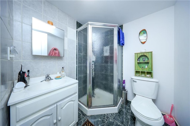 78 Townsend Ave, Staten Island, NY 10304 - full bathroom with vanity, toilet, a stall shower, tile walls, and marble finish floors