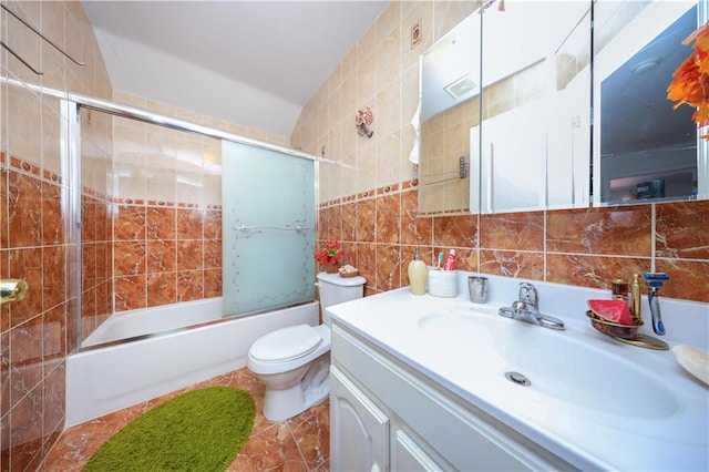78 Townsend Ave, Staten Island, NY 10304 - full bathroom with tile walls, vanity, combined bath / shower with glass door, toilet, and backsplash