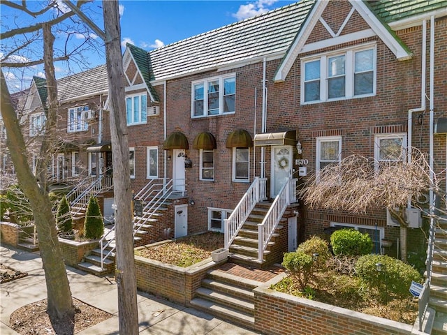 1572 E 34th St, Brooklyn, NY 11234 - view of front facade featuring brick siding and a tiled roof