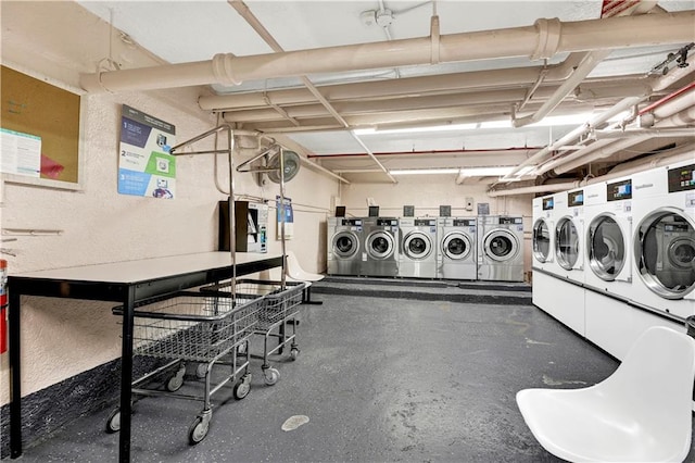 common laundry area featuring washing machine and clothes dryer
