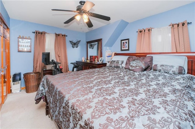 carpeted bedroom with a ceiling fan