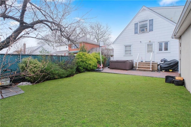 view of yard featuring a hot tub and a patio area