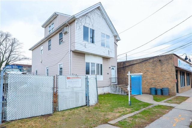 view of front of home with fence