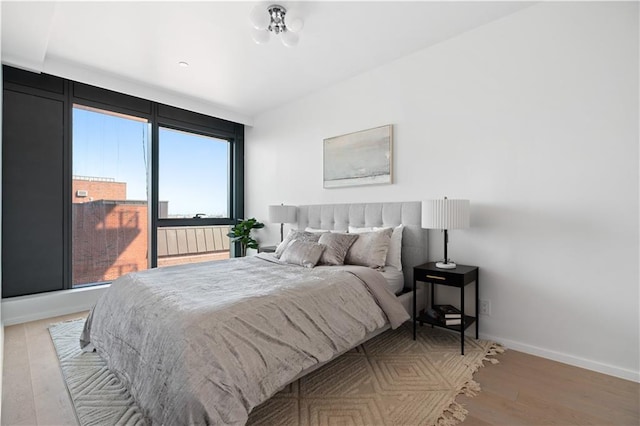 2286 Cropsey Ave Unit 5F, Brooklyn, NY 11214 - bedroom featuring baseboards and light wood finished floors