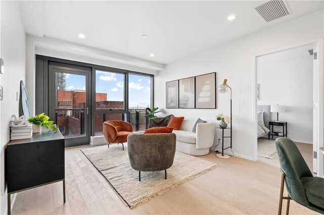 2286 Cropsey Ave Unit 5F, Brooklyn, NY 11214 - living room with baseboards, recessed lighting, light wood-style flooring, and visible vents