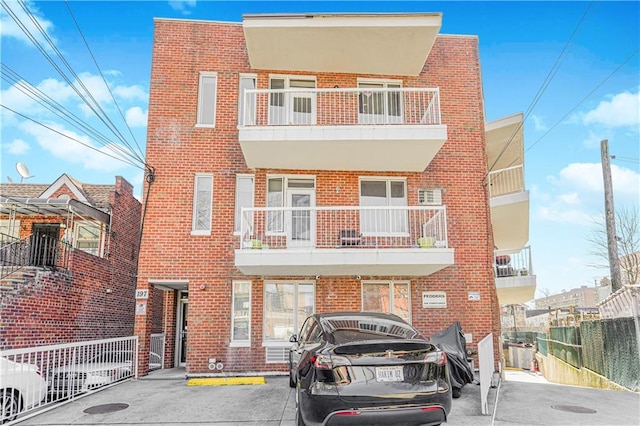 197 Bay 47th St Unit 5, Brooklyn, NY 11214 - view of front facade with brick siding and fence