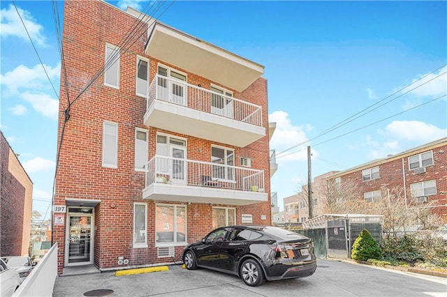 197 Bay 47th St Unit 5, Brooklyn, NY 11214 - view of front of house with brick siding and uncovered parking