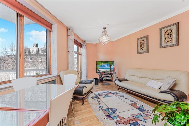 197 Bay 47th St Unit 5, Brooklyn, NY 11214 - living area featuring a chandelier, wood finished floors, and crown molding