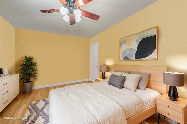 1310 84th St Unit 1A, Brooklyn, NY 11228 - bedroom with light wood finished floors, a ceiling fan, and baseboards
