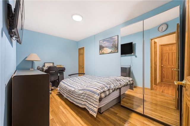 9040 Fort Hamilton Pkwy Unit 3K, Brooklyn, NY 11209 - bedroom featuring light wood-type flooring and an office area