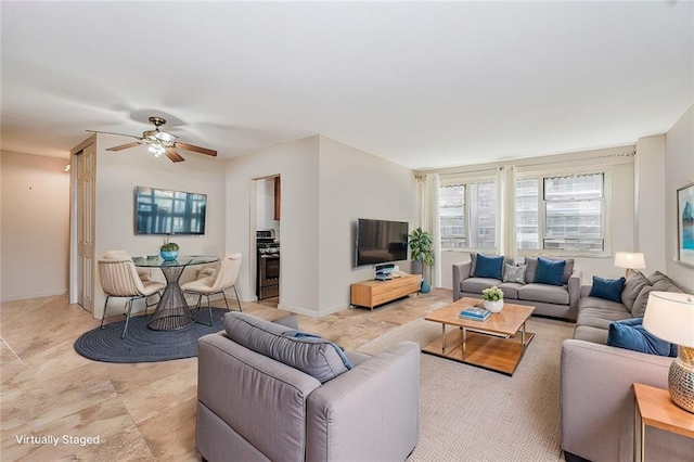 2928 W 5th St Unit 5F, Brooklyn, NY 11224 - living room with ceiling fan and baseboards