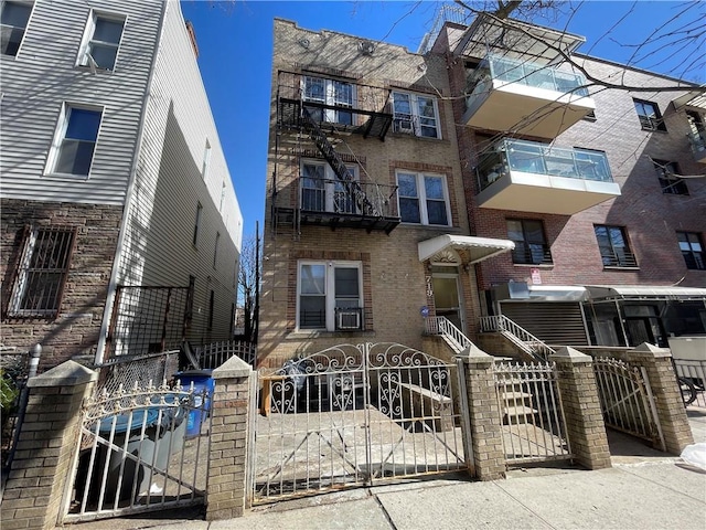 719 41st St, Brooklyn, NY 11232 - view of apartment building / complex featuring a fenced front yard and cooling unit