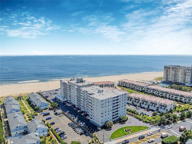 drone / aerial view of extended coastline and apartment complex