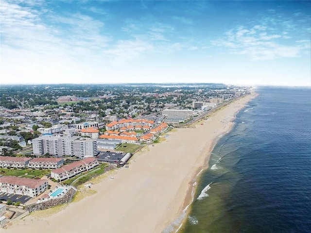 aerial view of waterfront with a beach