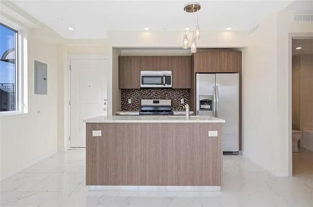 8794 17th Ave Unit 301, Brooklyn, NY 11214 - kitchen featuring stainless steel appliances, modern cabinets, light countertops, electric panel, and light marble finish floors