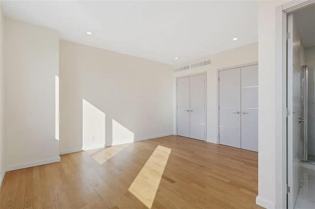 8794 17th Ave Unit 301, Brooklyn, NY 11214 - empty room featuring wood finished floors and recessed lighting