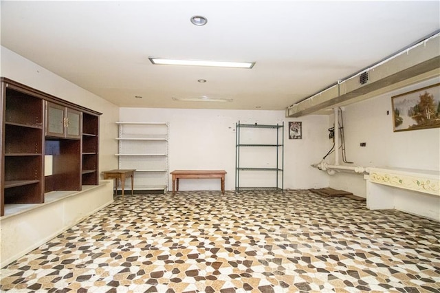 basement featuring recessed lighting