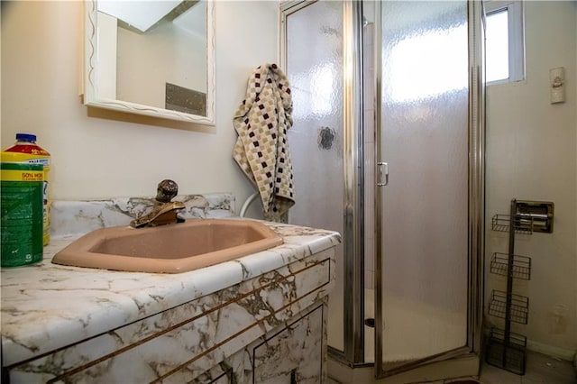 full bathroom featuring a sink and a shower stall