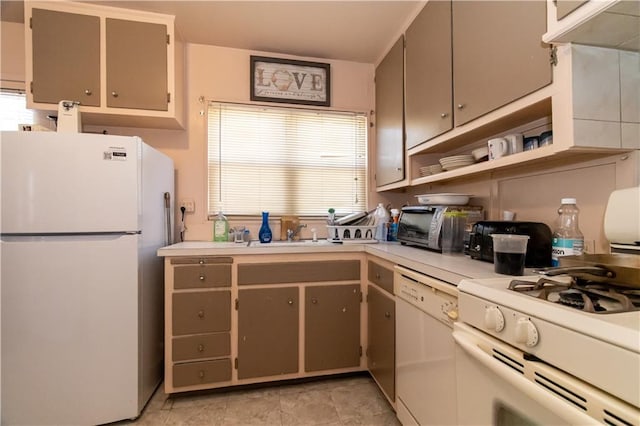 kitchen with white appliances, light countertops, a sink, and open shelves