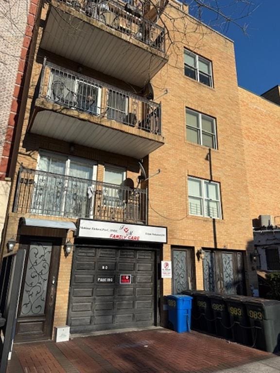 983 E 12th St Unit B, Brooklyn, NY 11230 - view of property with driveway and an attached garage