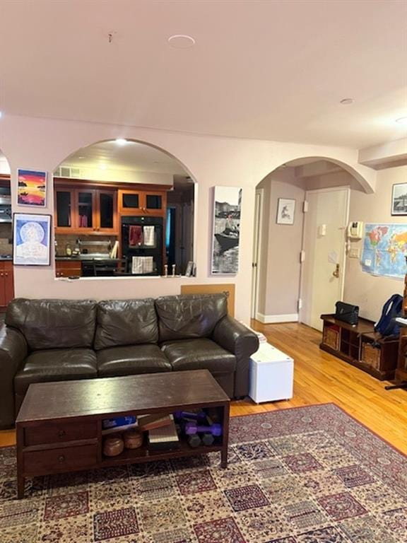 983 E 12th St Unit B, Brooklyn, NY 11230 - living area with arched walkways and wood finished floors