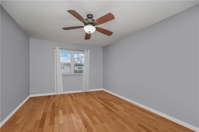 341 Hillman Ave, Staten Island, NY 10314 - empty room featuring baseboards, light wood-style flooring, and a ceiling fan
