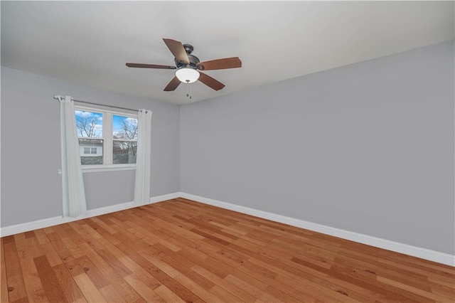 341 Hillman Ave, Staten Island, NY 10314 - unfurnished room with baseboards, light wood-style floors, and a ceiling fan