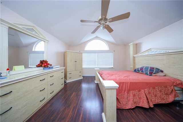 bedroom with a ceiling fan, dark wood finished floors, and lofted ceiling